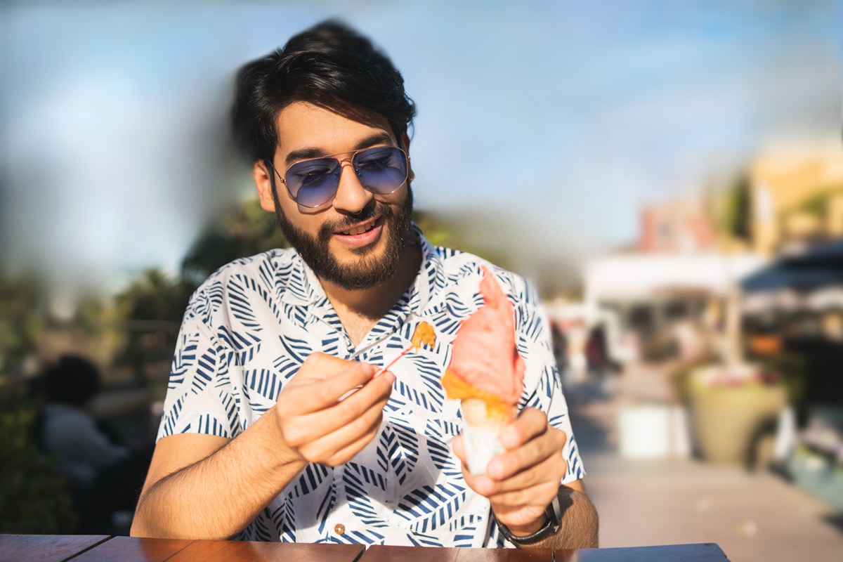 Man eating ice cream outdoors