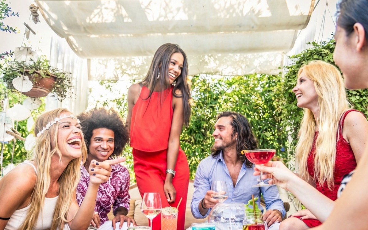 Friends Dining and Socializing Outdoors in Sunshine