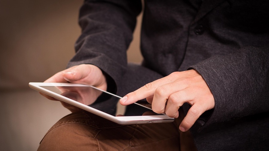 Person on Tablet Joining Mailing List